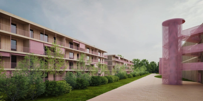Moderní panelový dům s balkony v zeleném prostředí.